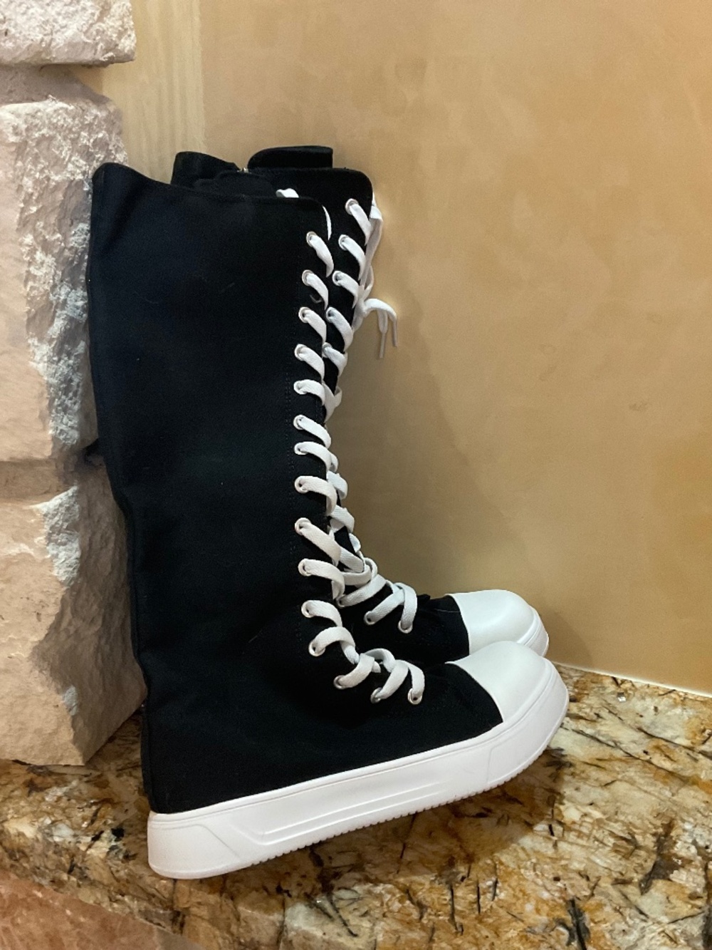 Brand new knee high canvas black/white lace up boots. Euro sz 38. Perfect!!